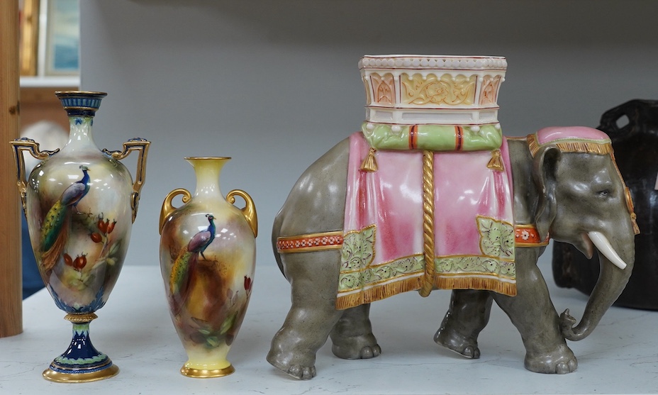 A Hadley's Worcester elephant with howdah and two Hadleys vases, peacock decoration, tallest 19.5cm. Condition - good